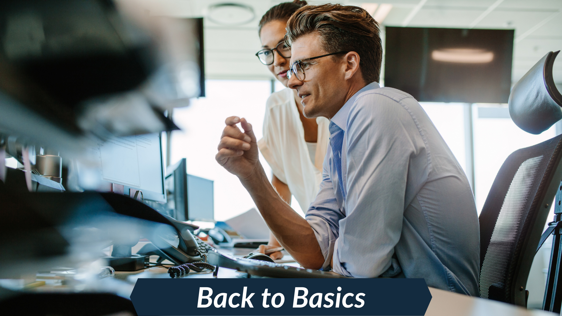 people looking at data on a computer